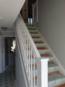Close up view of staircase painted white by Premier Swansea painters and decorators in property in Llansamlet, Swansea