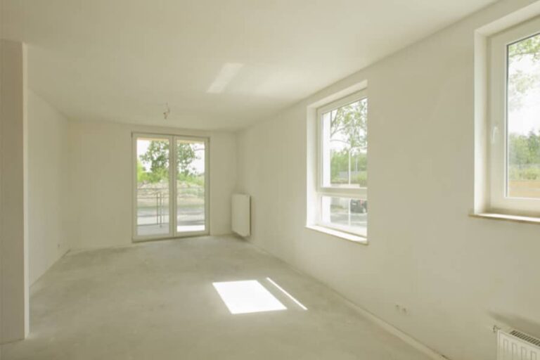 newly built home showing rear room showing walls and ceiling recently painted with eggsheel white matt paint